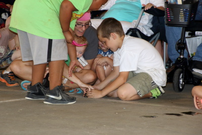 A bullfrog from the race escaped into the crowd but was caught by a mother & son