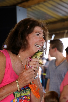 Club member with side profile of her holding Bullfrog