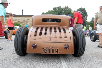 Crowd admiring Jason Graham's low riding louvered satin finished hot rod