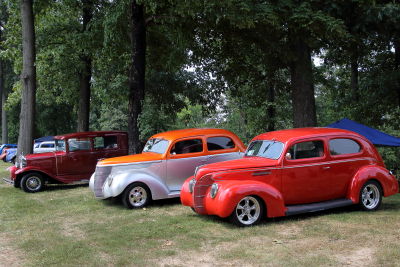 Red 39, Orange & Silver 40, Burgandy 29/30 Ford parked at the Frog Follies