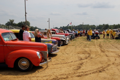 Award winning cars lined up in the arena for the award presentation