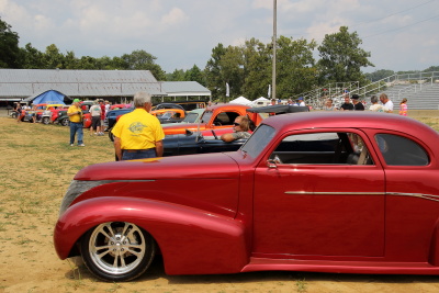 Award winning cars lined up in the arena for the award presentation