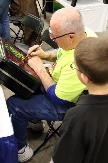 Our grandson enjoyed watching this particular pin stripper doing Rat Fink on a suitcase