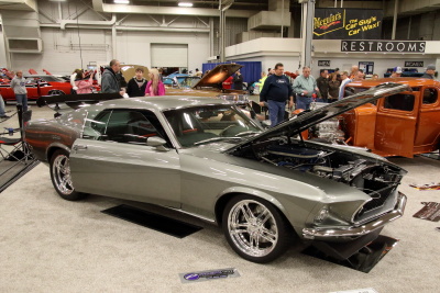 side shot of a Silver with Black stripes Fastback Mustang