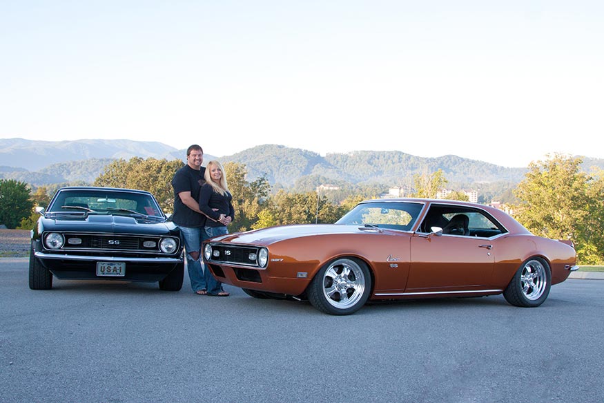 Michelle and Ron with their camaros