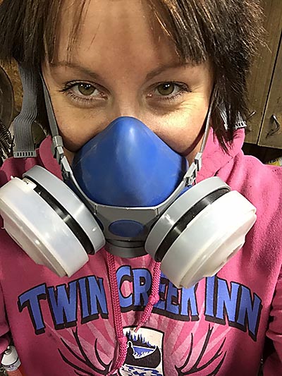 Samantha making sure to be safe with filter equipment for breathing