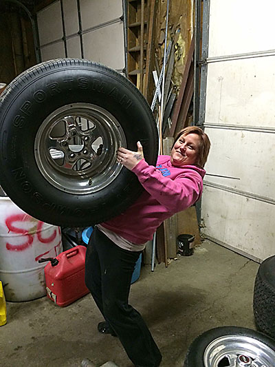 Samantha is Handling holding her wheel & tire